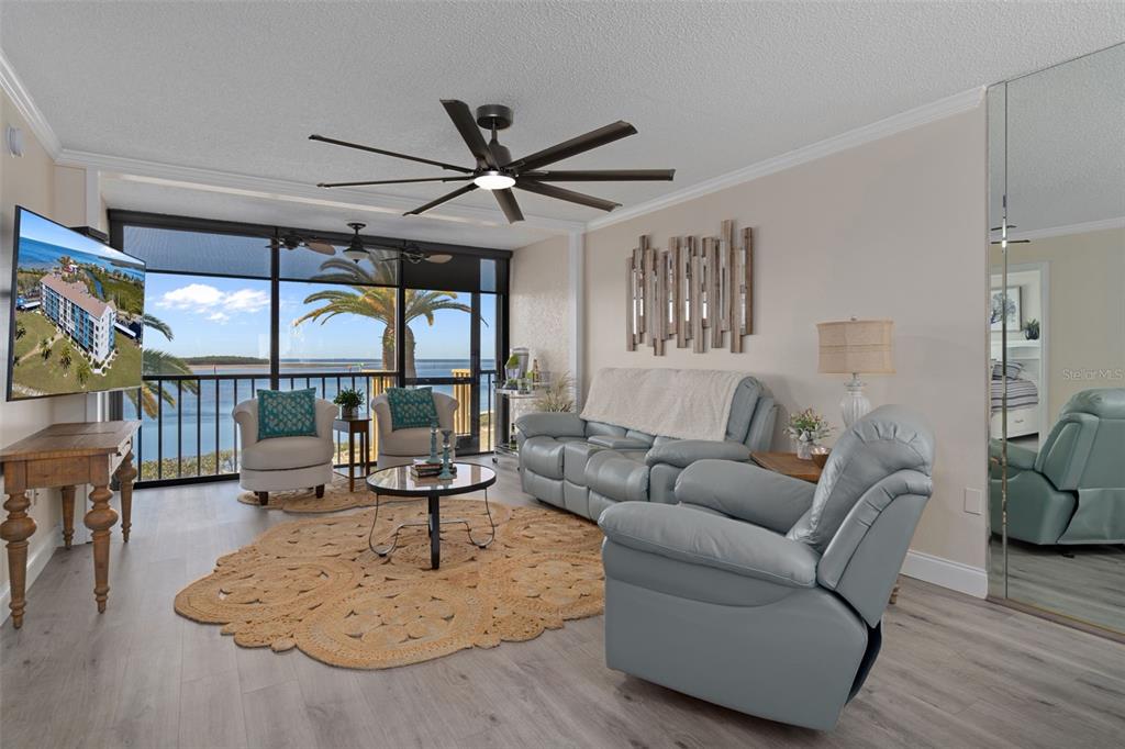 4550 Bay Boulevard, Unit 1211 Port Richey, FL 34668 - Photo 9 of 65 a living room with furniture and a large window