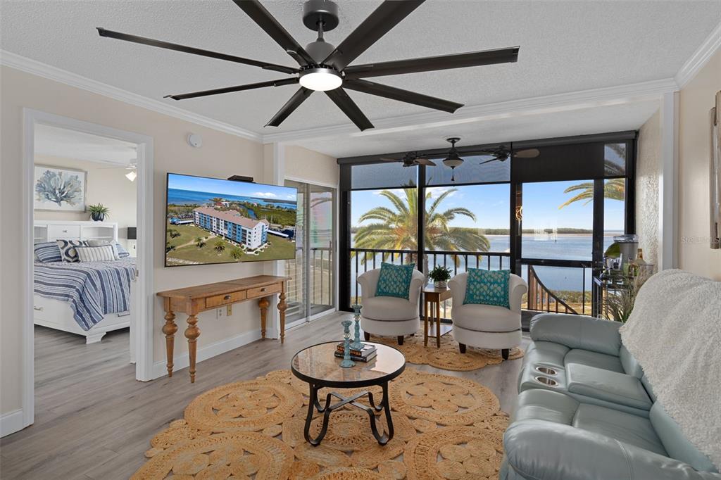 4550 Bay Boulevard, Unit 1211 Port Richey, FL 34668 - Photo 10 of 65 a living room with furniture and a large window