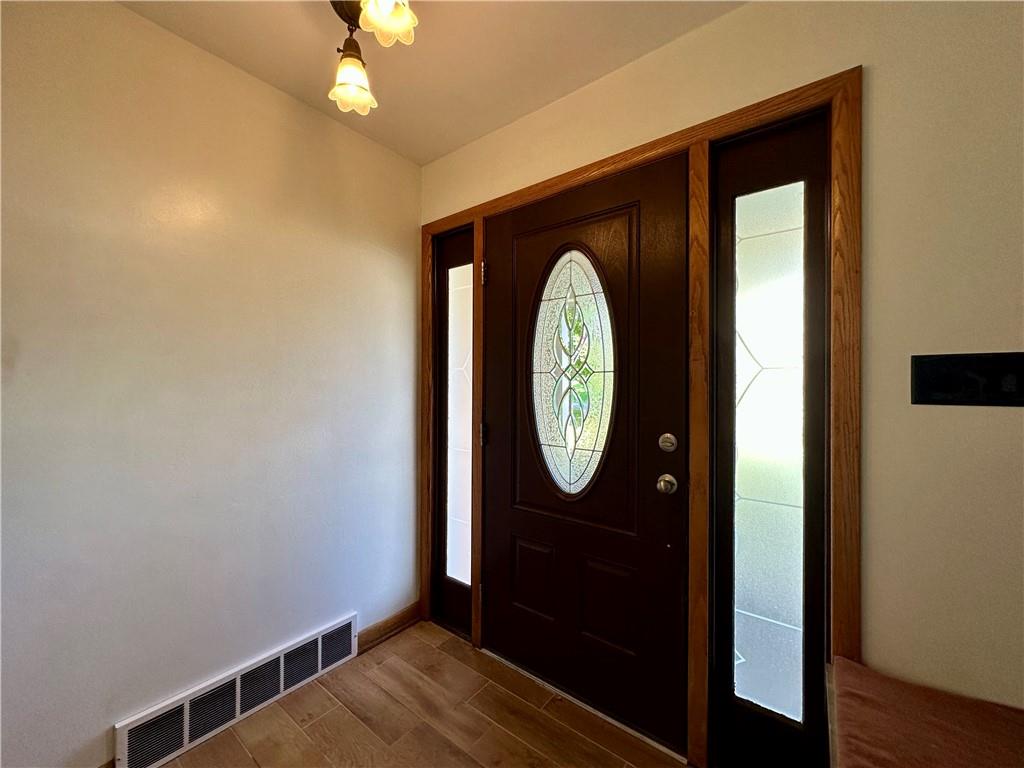 3025 Spring Garden Avenue New Castle, PA 16105 - Photo 11 of 37 a view of a hallway with wooden floor