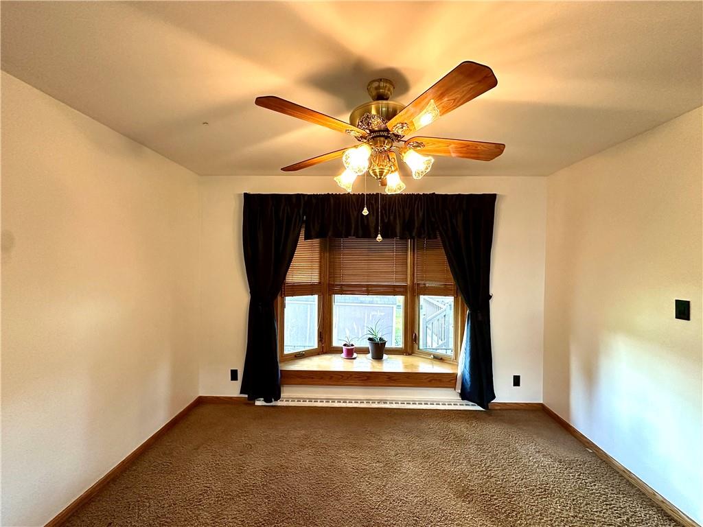 3025 Spring Garden Avenue New Castle, PA 16105 - Photo 13 of 37 a view of an empty room with a fireplace