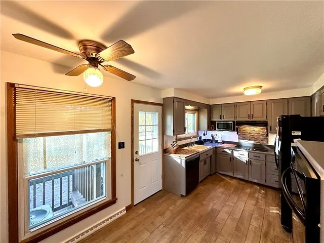 a kitchen with lots of counter top space and appliances