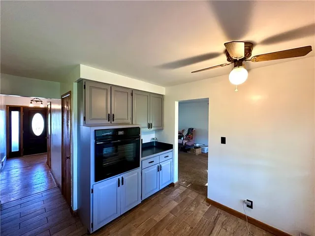 a view of living room with furniture and wooden floor