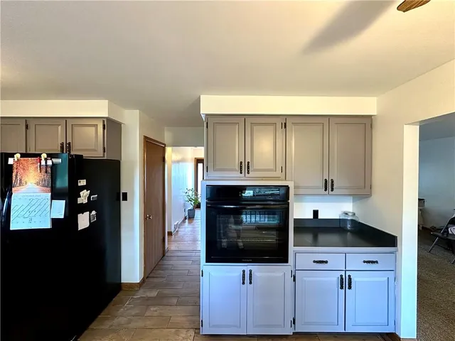 a kitchen with stainless steel appliances a stove microwave and refrigerator