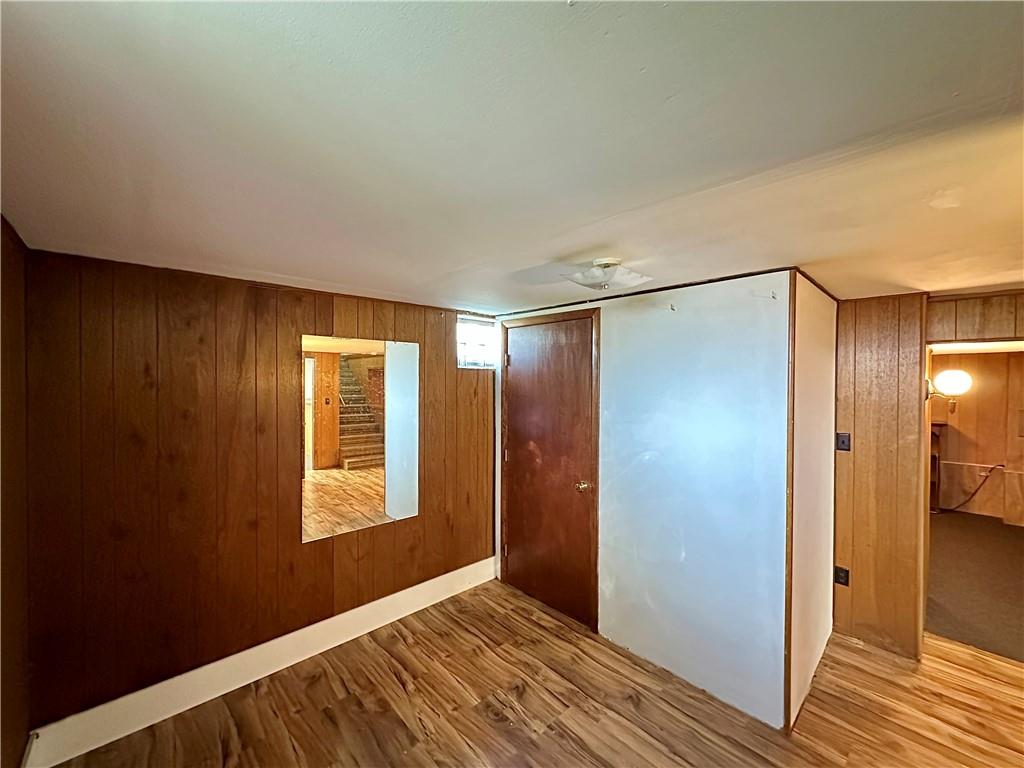 3025 Spring Garden Avenue New Castle, PA 16105 - Photo 28 of 37 a view of an empty room with wooden floor and a bathroom