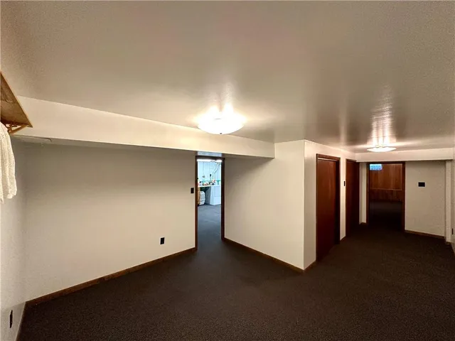 a view of yard with swimming pool and green space