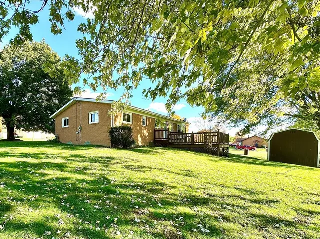 a house view with a sitting space and garden