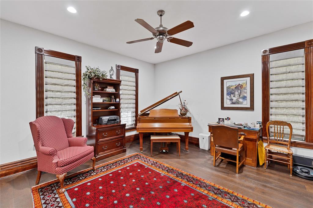 304 North Church Street Pilot Point, TX 76258 - Photo 19 of 40 a living room with furniture a piano and a bookshelf