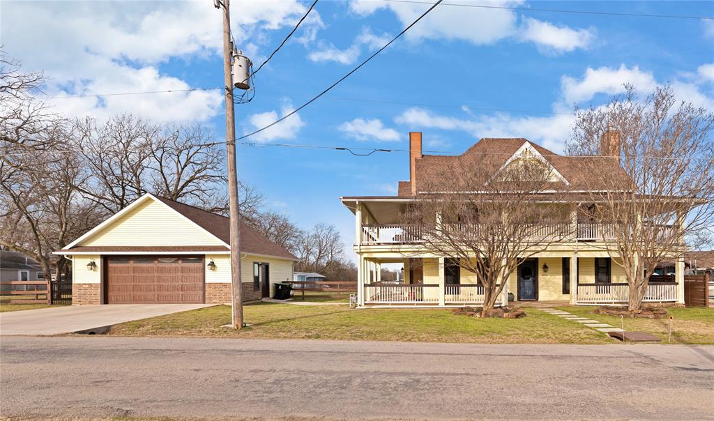 304 North Church Street Pilot Point, TX 76258 - Photo 2 of 40 a front view of a house with a yard