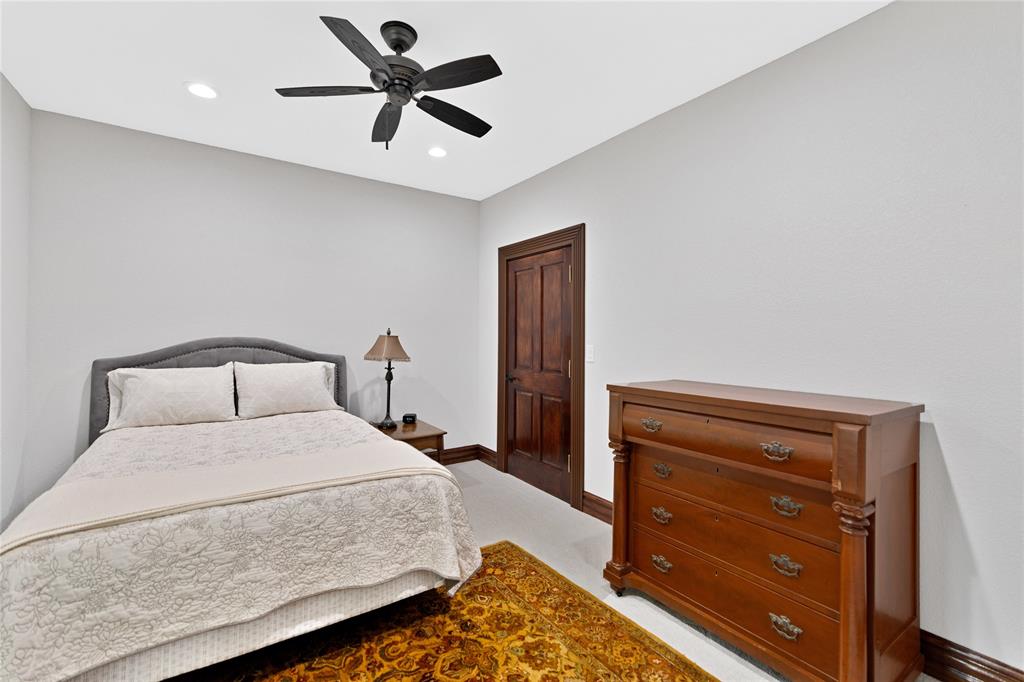 304 North Church Street Pilot Point, TX 76258 - Photo 27 of 40 a bedroom with a bed and a dresser