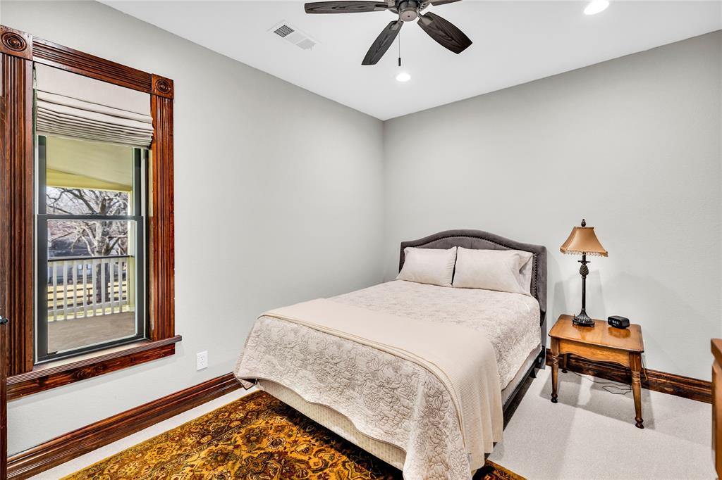 304 North Church Street Pilot Point, TX 76258 - Photo 28 of 40 a spacious bedroom with a bed and a window
