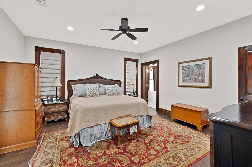 304 North Church Street Pilot Point, TX 76258 - Photo 32 of 40 a bedroom with a bed and wooden floor