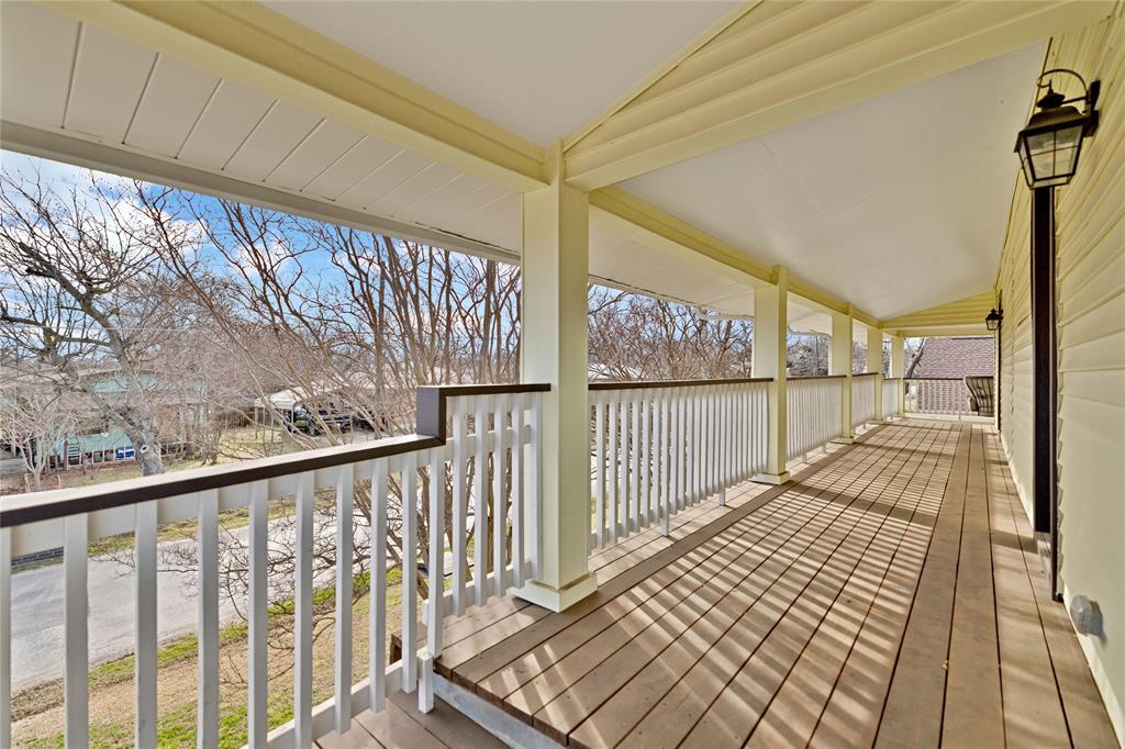 304 North Church Street Pilot Point, TX 76258 - Photo 38 of 40 a view of a balcony with wooden floor