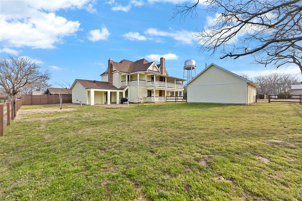 304 North Church Street Pilot Point, TX 76258 - Photo 39 of 40 a large body of water with a building in the background