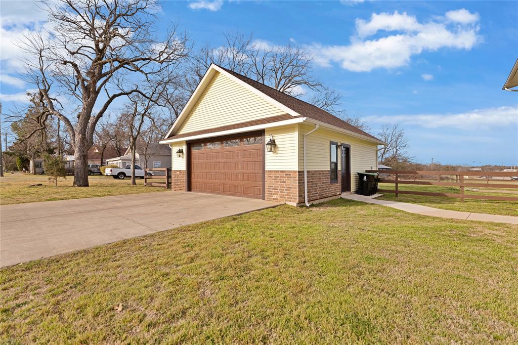304 North Church Street Pilot Point, TX 76258 - Photo 4 of 40 a view of a yard in front of a house