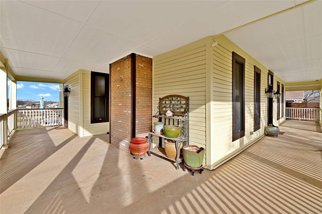 304 North Church Street Pilot Point, TX 76258 - Photo 5 of 40 a view of a balcony with a patio