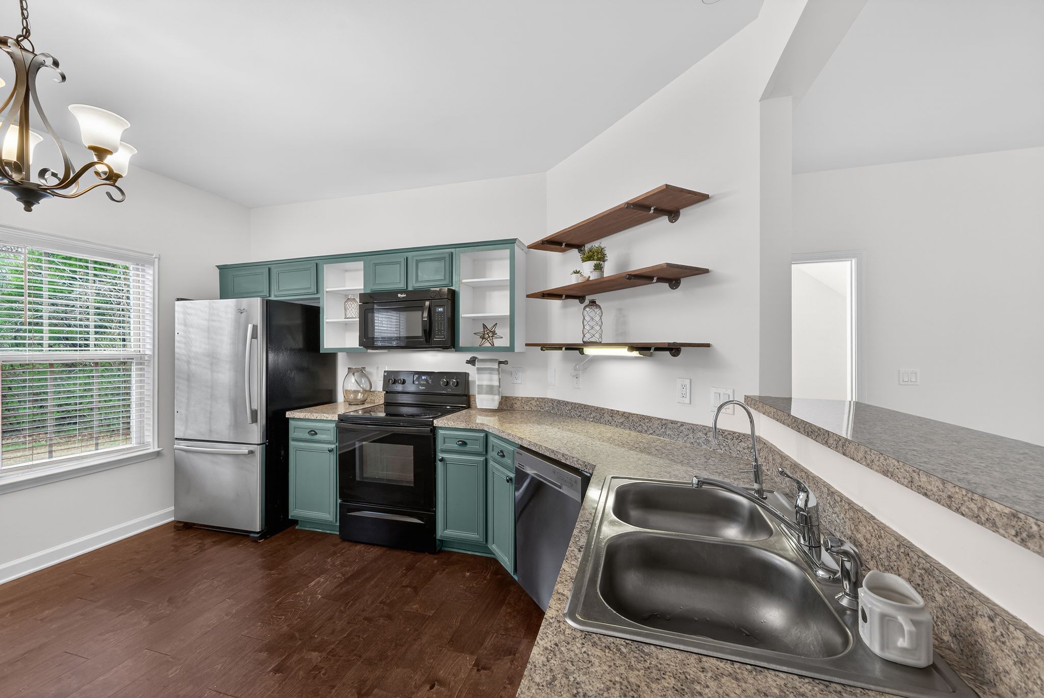 735 Tulip Grove Road, Unit 358 Hermitage, TN 37076 - Photo 12 of 37 a kitchen with stainless steel appliances granite countertop a sink a stove and a refrigerator