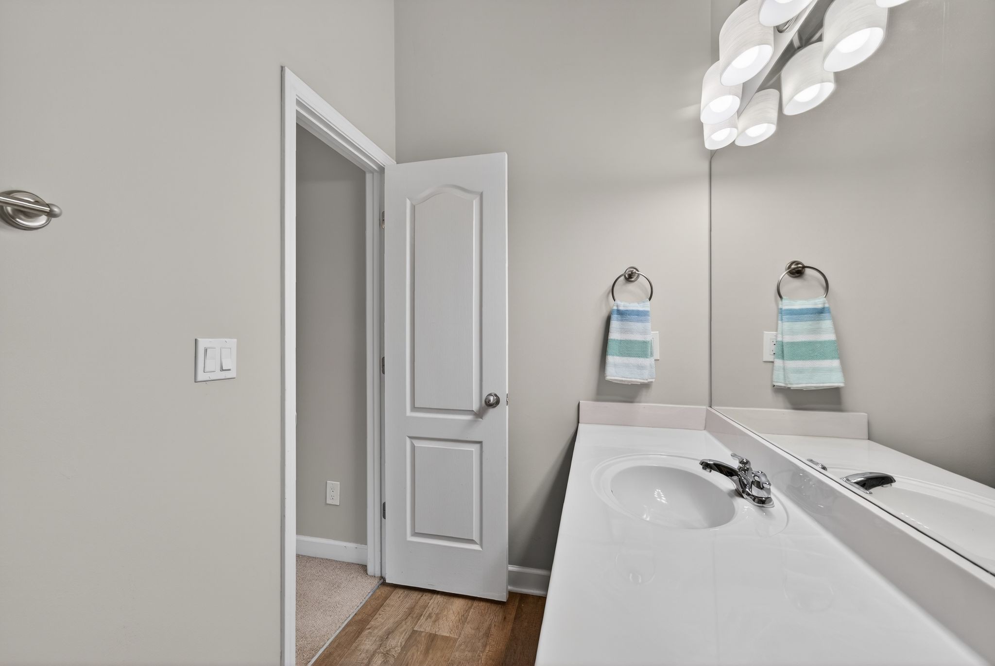735 Tulip Grove Road, Unit 358 Hermitage, TN 37076 - Photo 24 of 37 a bathroom with a sink a mirror and vanity