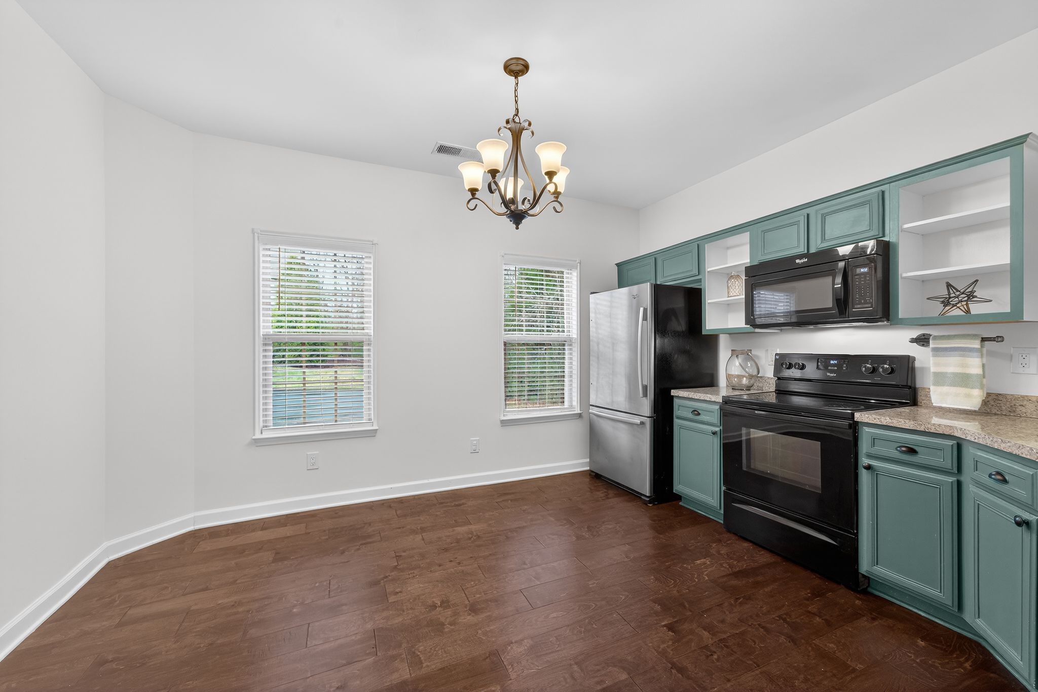 735 Tulip Grove Road, Unit 358 Hermitage, TN 37076 - Photo 10 of 37 a view of a kitchen with a stove cabinets and stainless steel appliances