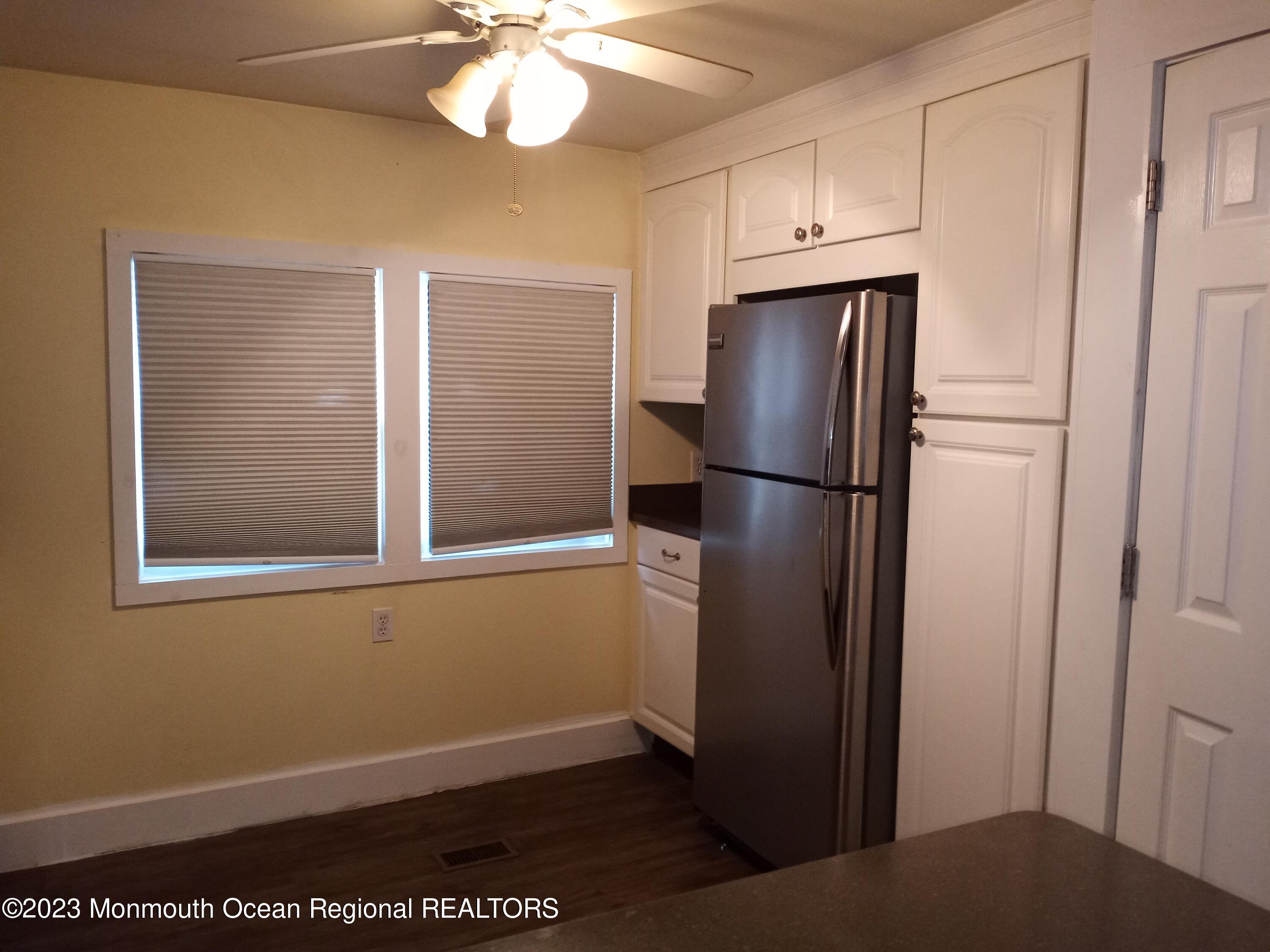 274 Lane C Hazlet, NJ 07730 - Photo 5 of 19 a view of kitchen with a refrigerator cabinets and wooden floor