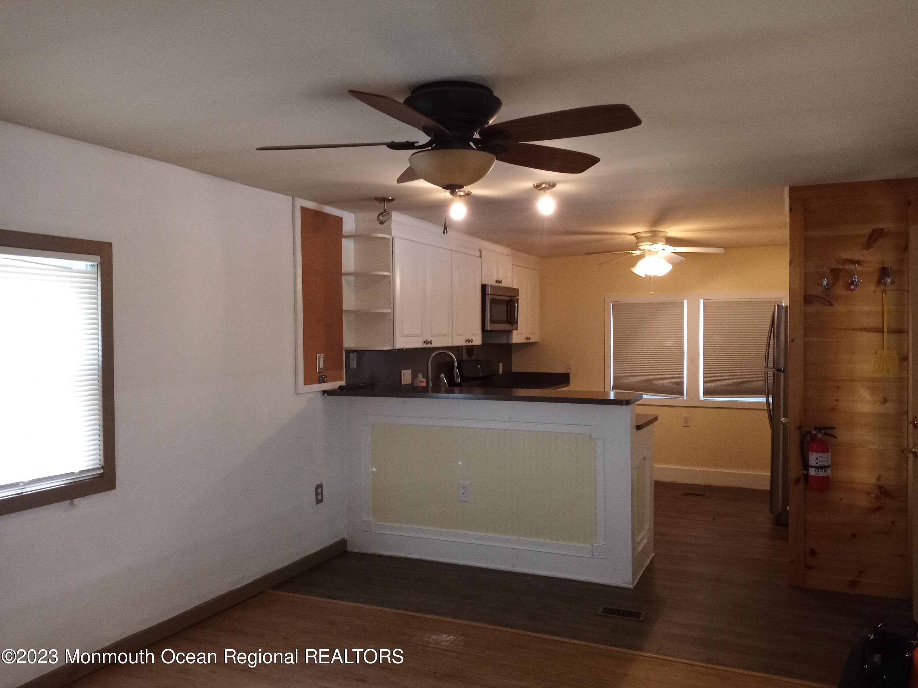 274 Lane C Hazlet, NJ 07730 - Photo 6 of 19 a kitchen with a refrigerator and a counter top