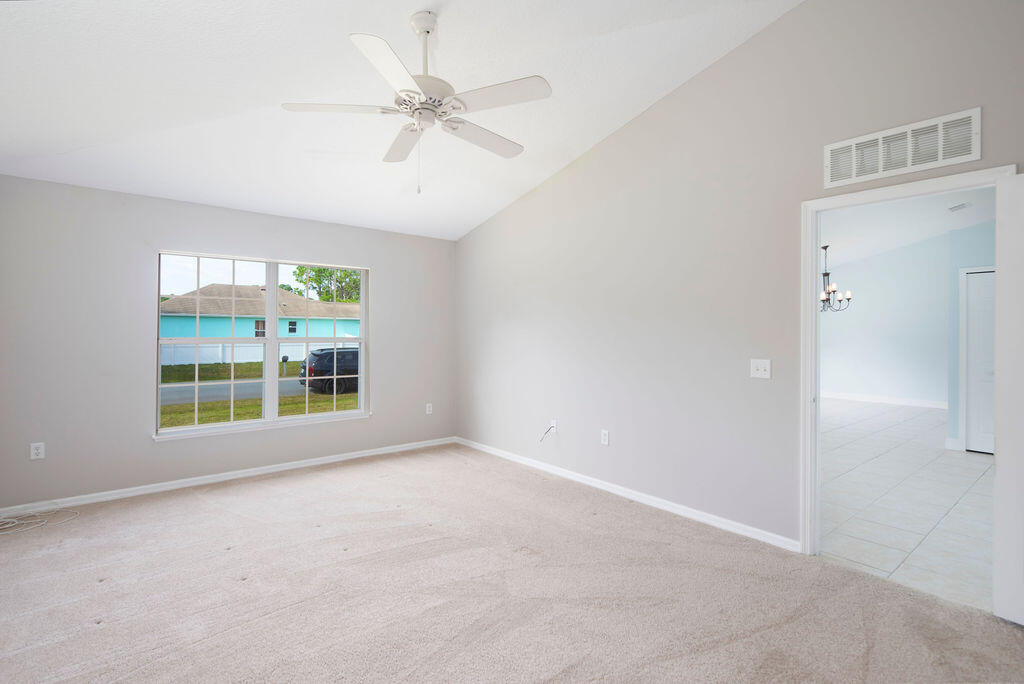 1815 Dragon Road Southeast Palm Bay, FL 32909 - Photo 20 of 41 an empty room with windows and fan