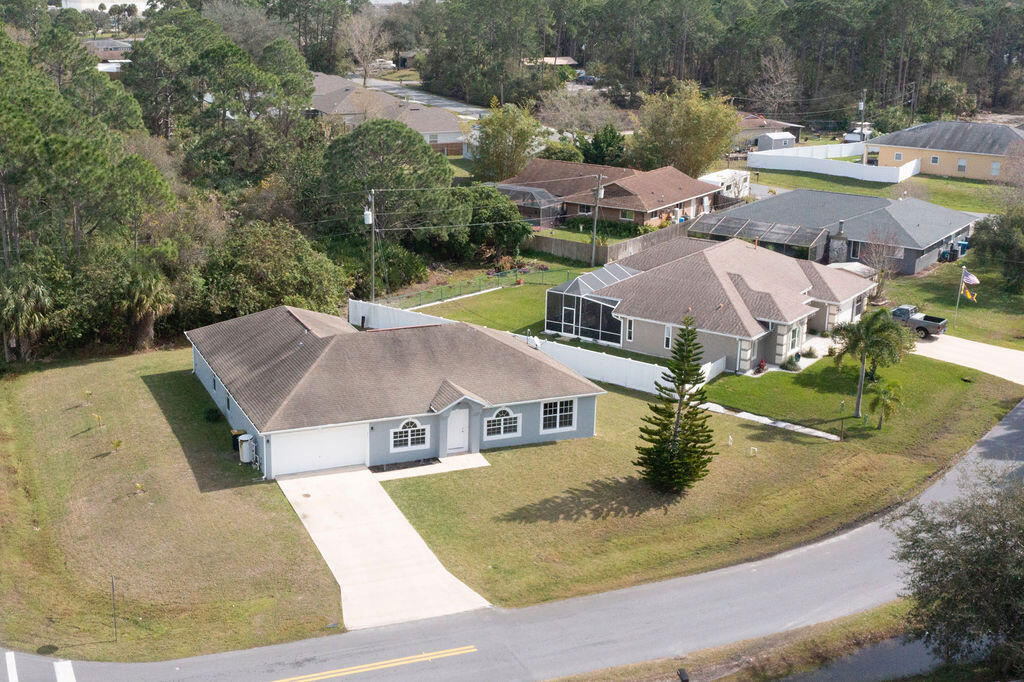 1815 Dragon Road Southeast Palm Bay, FL 32909 - Photo 2 of 41 an aerial view of residential houses with outdoor space