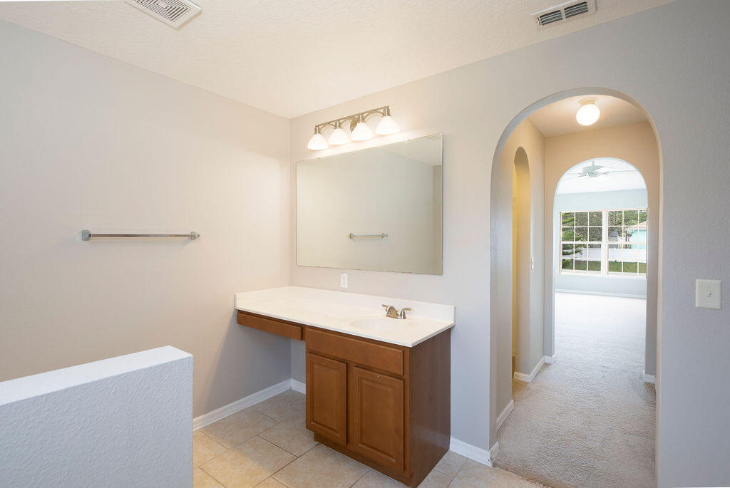 1815 Dragon Road Southeast Palm Bay, FL 32909 - Photo 24 of 41 a room with a sink cabinets and utility room