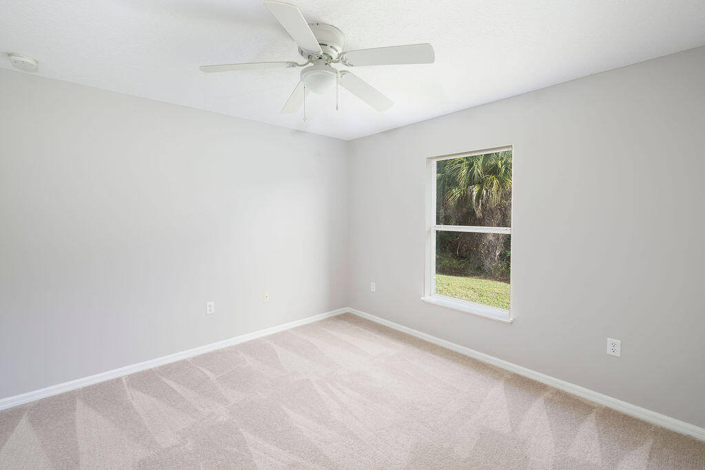 1815 Dragon Road Southeast Palm Bay, FL 32909 - Photo 29 of 41 an empty room with a window and a fan