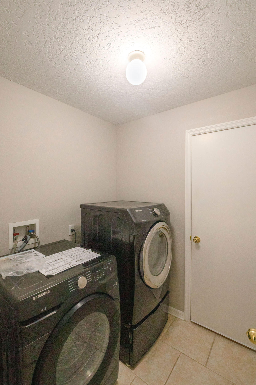 1815 Dragon Road Southeast Palm Bay, FL 32909 - Photo 32 of 41 a utility room with dryer and washer