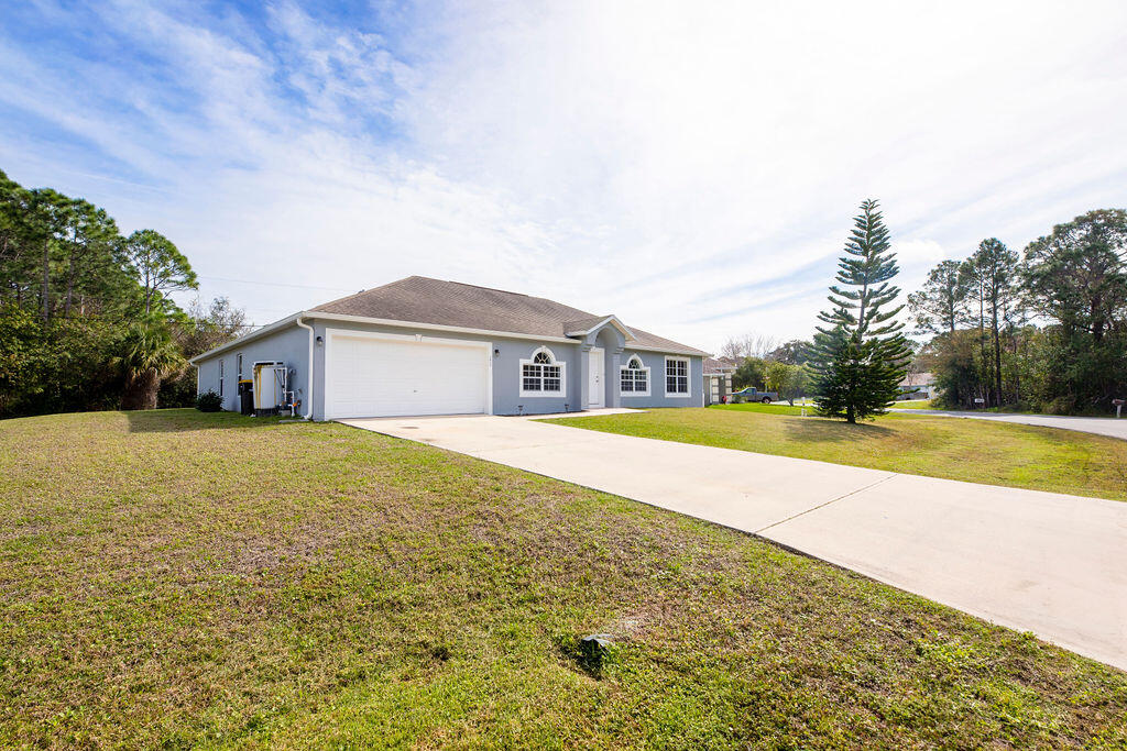 1815 Dragon Road Southeast Palm Bay, FL 32909 - Photo 4 of 41 a view of house with a swimming pool