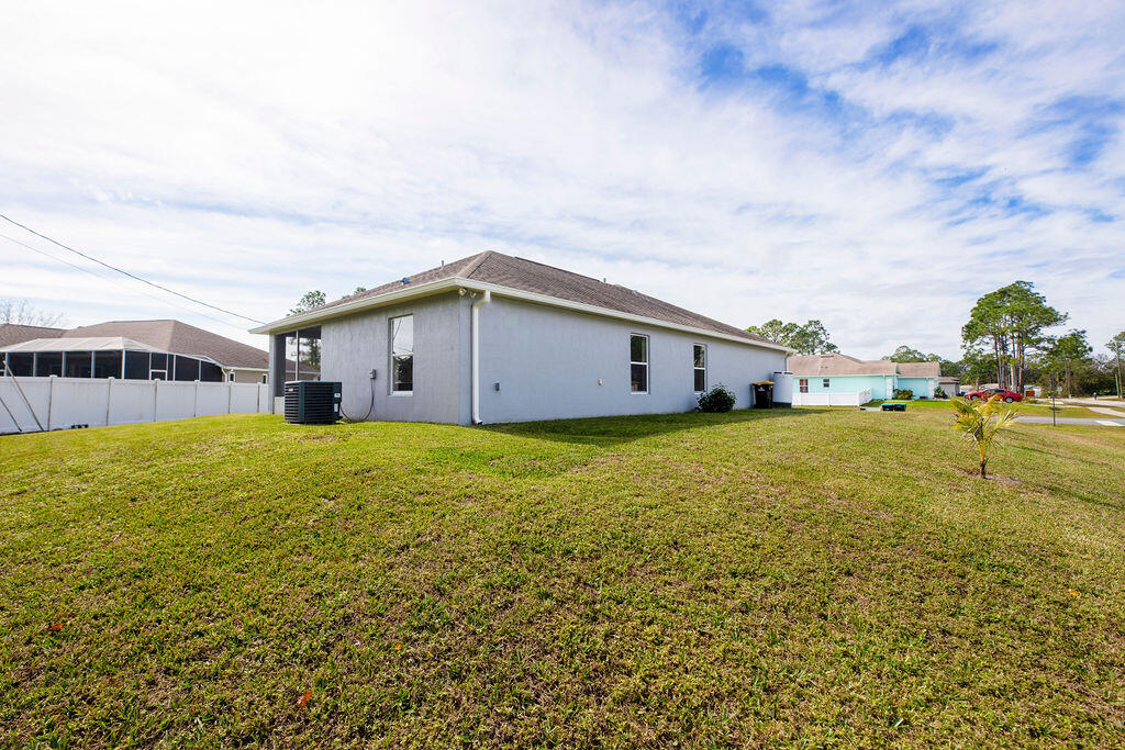 1815 Dragon Road Southeast Palm Bay, FL 32909 - Photo 6 of 41 a house view with swimming pool in front of it