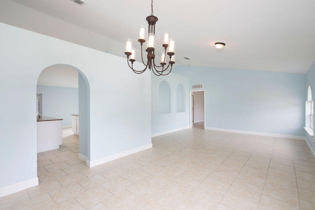 1815 Dragon Road Southeast Palm Bay, FL 32909 - Photo 9 of 41 a view of an empty room with a window