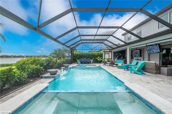 a view of a backyard with sitting area