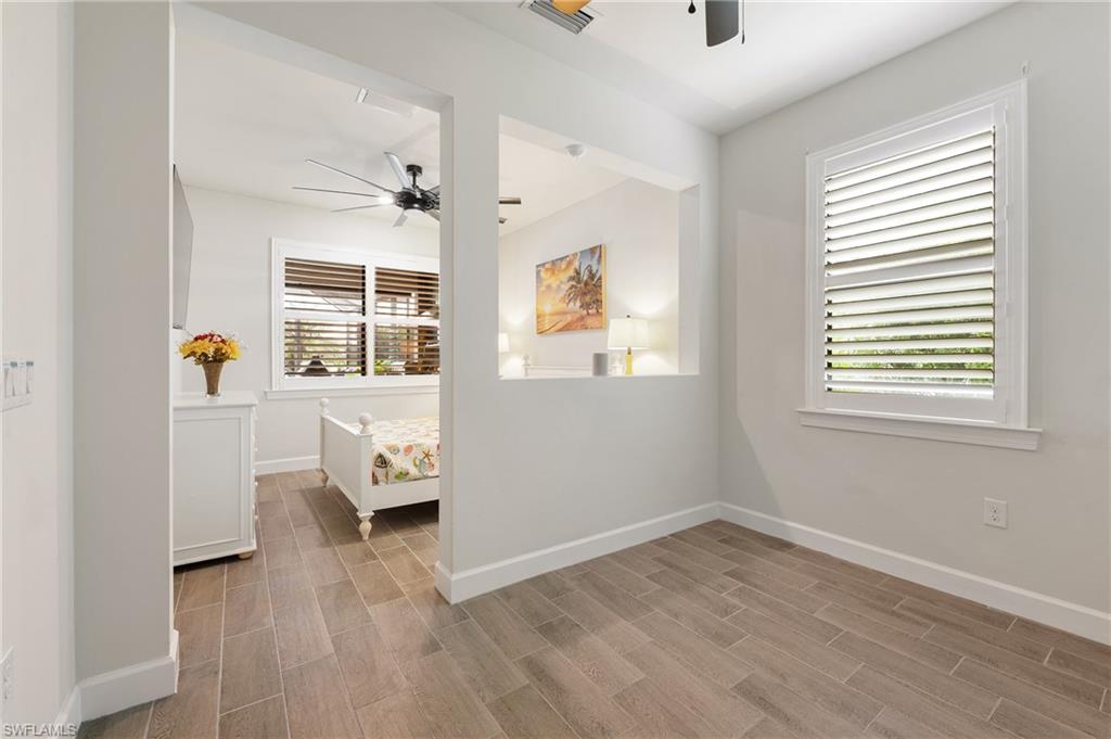 19157 Elston Way Estero, FL 33928 - Photo 13 of 50 an empty room with a window and wooden floor