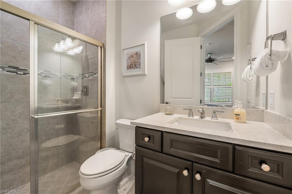 19157 Elston Way Estero, FL 33928 - Photo 18 of 50 a bathroom with a sink toilet and shower