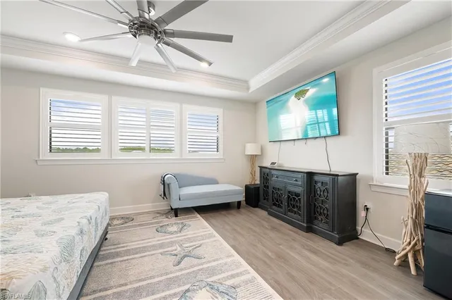 a bedroom with furniture window and flowerpot