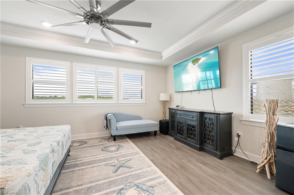 19157 Elston Way Estero, FL 33928 - Photo 21 of 50 a bedroom with furniture window and flowerpot