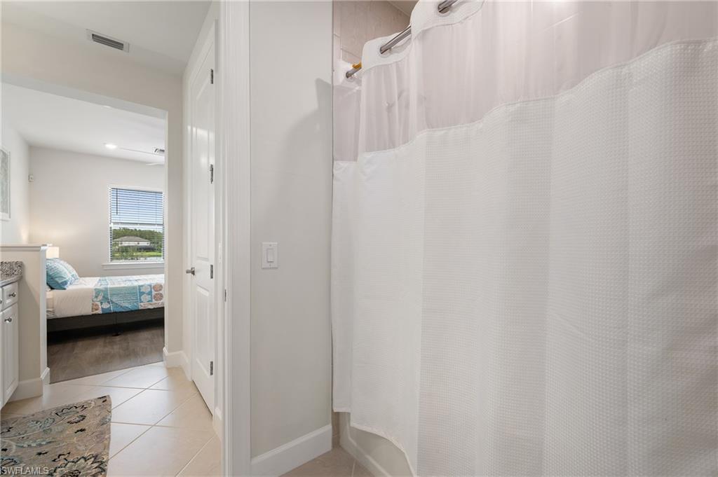 19157 Elston Way Estero, FL 33928 - Photo 30 of 50 a view of a bedroom from a hallway