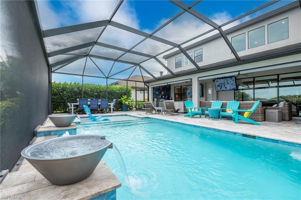 19157 Elston Way Estero, FL 33928 - Photo 33 of 50 a view of a swimming pool with patio
