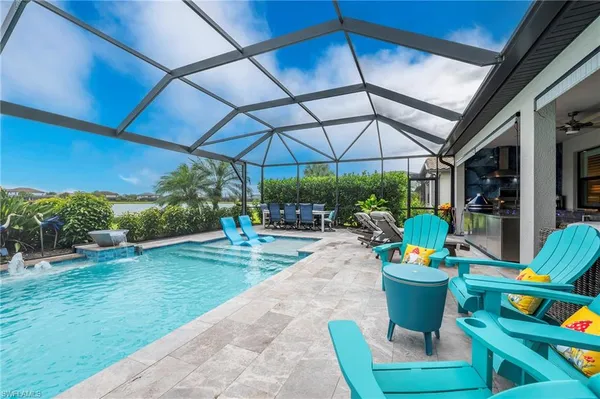 a view of a dining tables and chairs under an umbrella