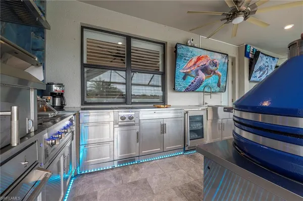 a kitchen with stove and cabinets