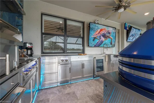 a kitchen with stove and cabinets