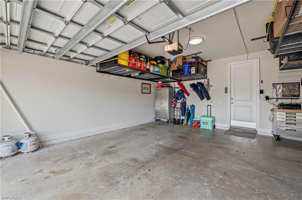 19157 Elston Way Estero, FL 33928 - Photo 41 of 50 a view of a garage with furniture