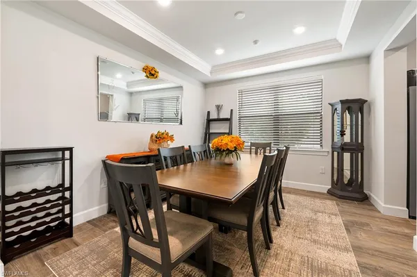 a view of a dining room with furniture window and wooden floor