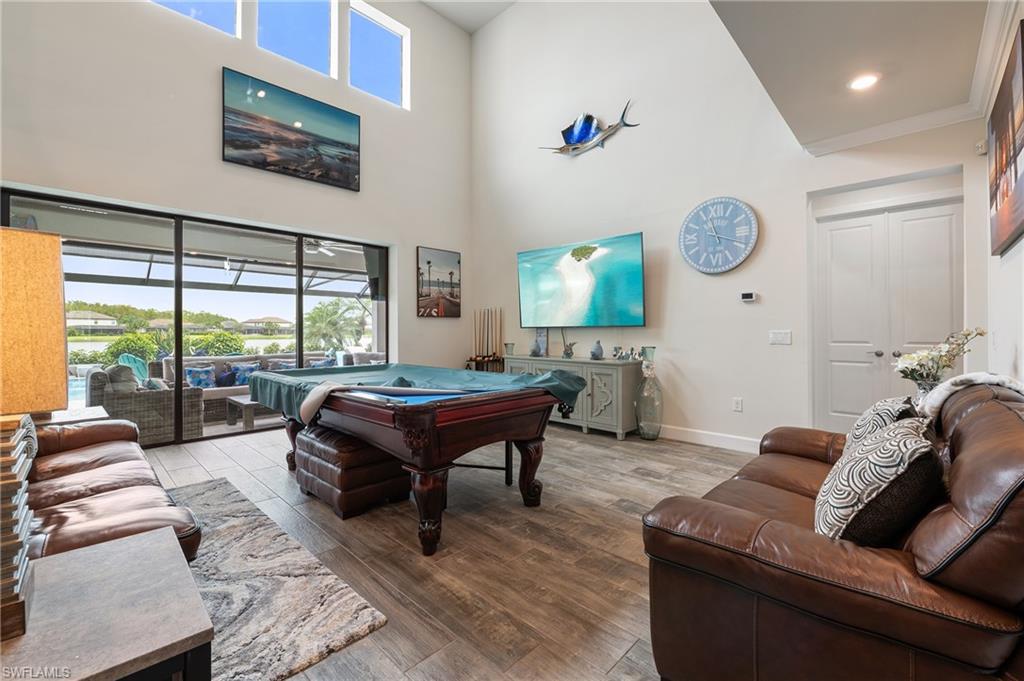 19157 Elston Way Estero, FL 33928 - Photo 9 of 50 a living room with furniture and a large window