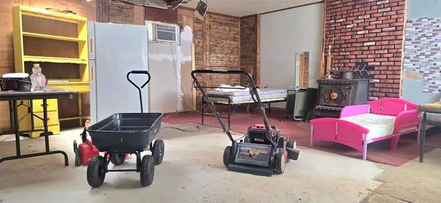 a living room with furniture and gym equipment