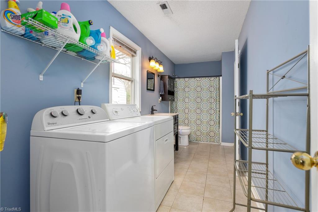 4306 Edgemore Road Greensboro, NC 27455 - Photo 18 of 26 Washer and dryer convey