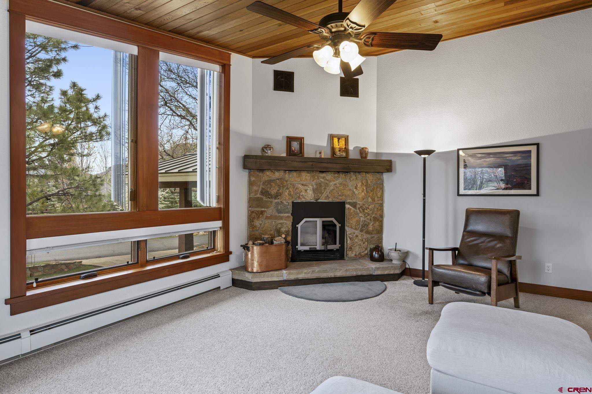 24 Songbird Lane Durango, CO 81301 - Photo 11 of 45 a living room with furniture and a fireplace