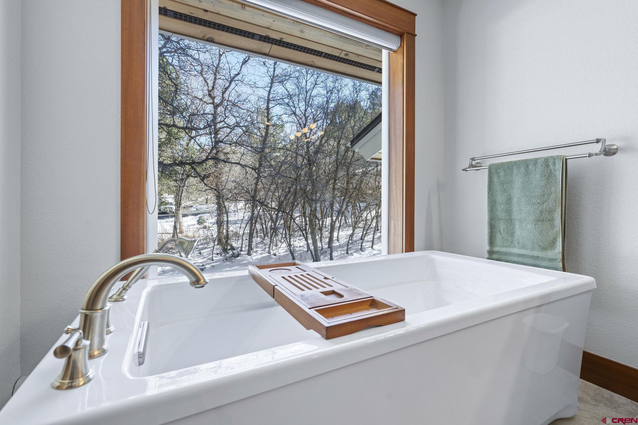 24 Songbird Lane Durango, CO 81301 - Photo 33 of 45 a room with a table and windows