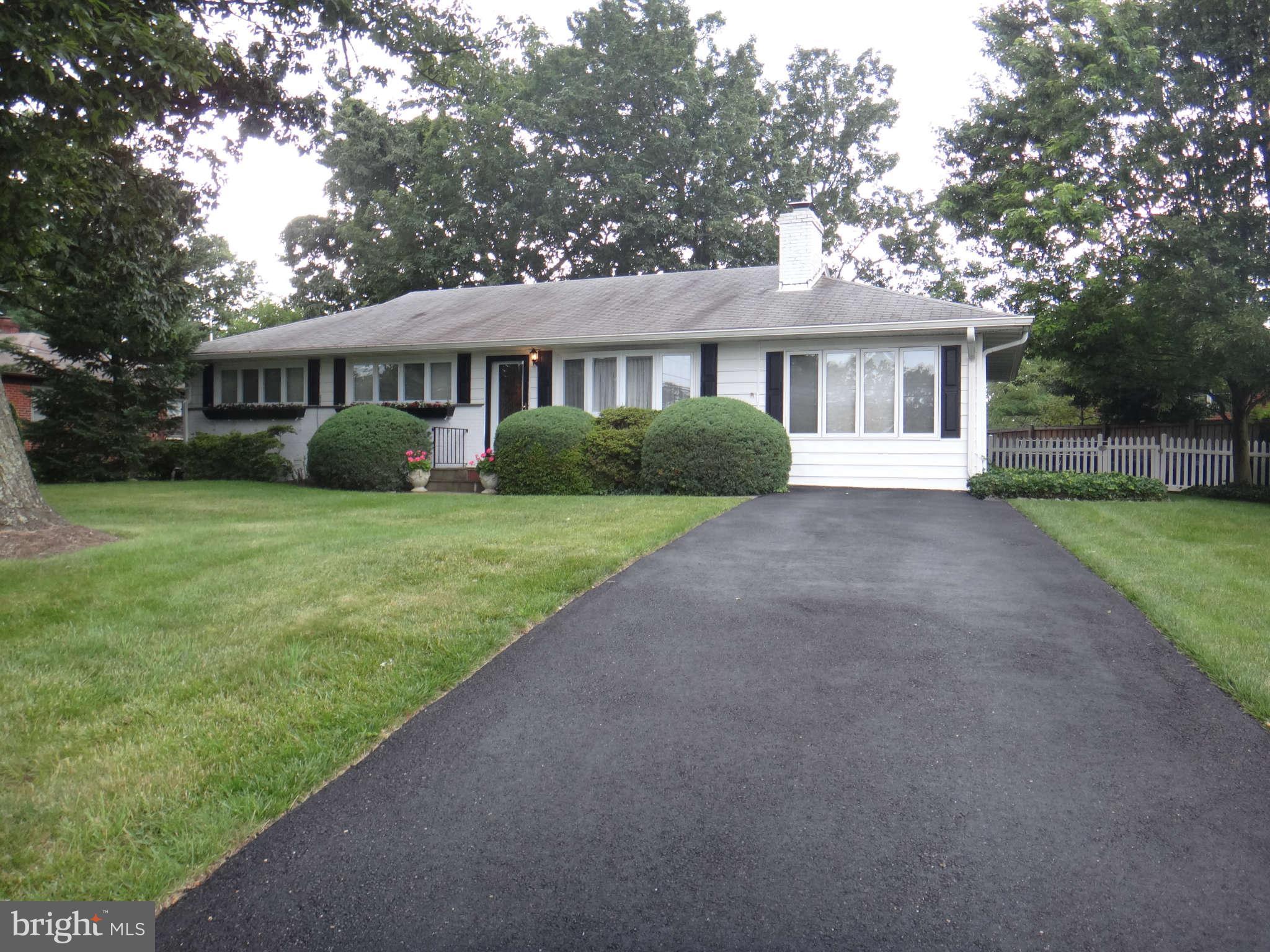 10128 Riggs Road Adelphi, MD 20783 - Photo 1 of 30 a view of a house with a yard